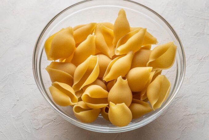 Uncooked jumbo pasta shells.
