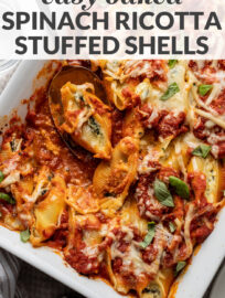 The only recipe you need for the best spinach and ricotta stuffed shells! This easy and classic baked pasta has all the best Italian flavors: three flavorful cheeses, tender garlicky spinach, and delicious marinara sauce, all nestled in jumbo pasta shells for a filling, comforting, and crowd-pleasing vegetarian dinner.