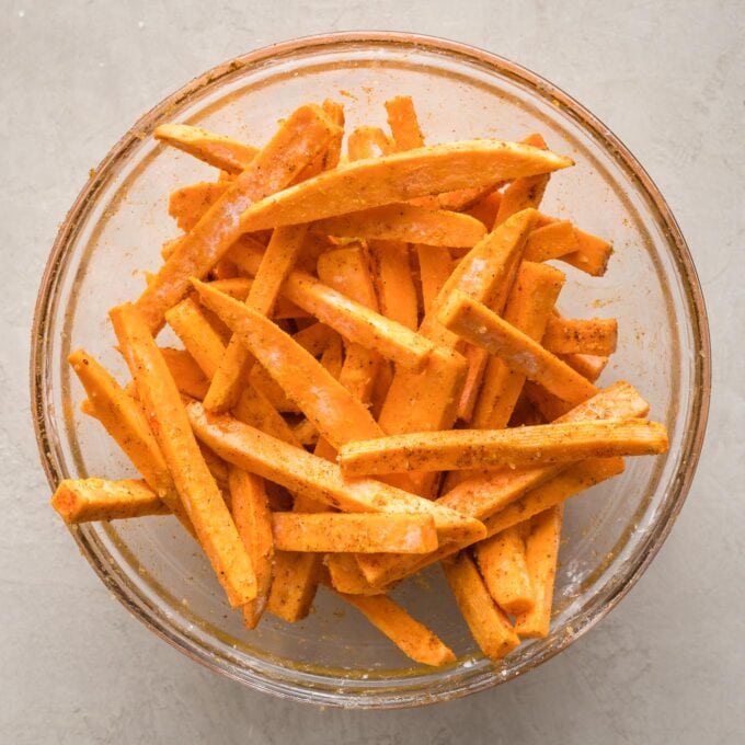 Seasoned fries in a prep bowl.