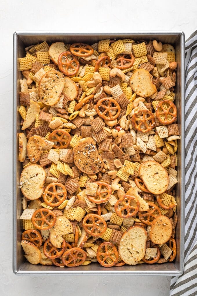 Cake pan filled with homemade Chex mix.