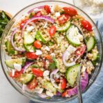 Pearl couscous salad with cucumbers, tomatoes, and feta.