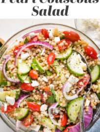 A pearl or Israeli couscous salad with cucumber, tomatoes, and feta is a fun, flavorful spring and summer side! Add a simple lemon dressing for an easy, healthy Mediterranean recipe everyone loves. This can be made ahead and served cold or at room temperature.
