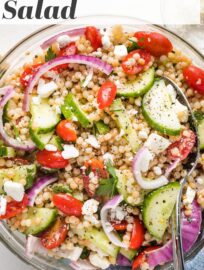 A pearl or Israeli couscous salad with cucumber, tomatoes, and feta is a fun, flavorful spring and summer side! Add a simple lemon dressing for an easy, healthy Mediterranean recipe everyone loves. This can be made ahead and served cold or at room temperature.