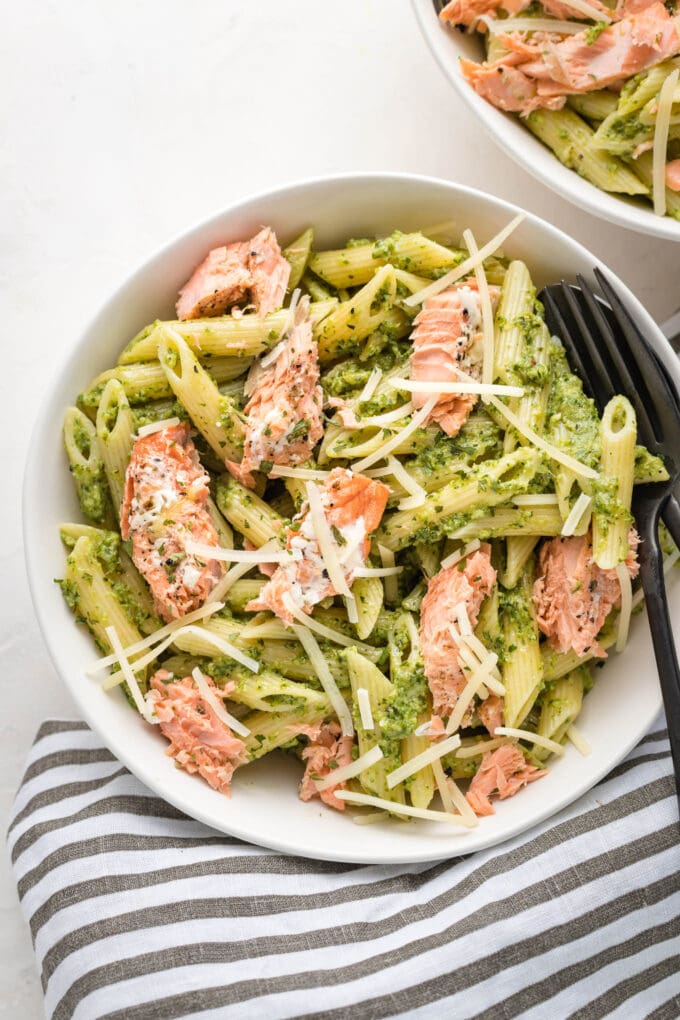 Bowls of salmon pesto pasta.