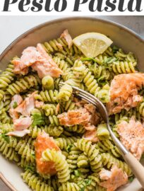 This Salmon Pesto Pasta recipe comes together in 25 minutes for a comforting yet healthy one-bowl meal. Roasting the salmon is hands-off yet delivers light flavor and texture, and using either homemade or jarred pesto to keep it flexible and weeknight-friendly.