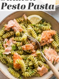 This Salmon Pesto Pasta recipe comes together in 25 minutes for a comforting yet healthy one-bowl meal. Roasting the salmon is hands-off yet delivers light flavor and texture, and using either homemade or jarred pesto to keep it flexible and weeknight-friendly.