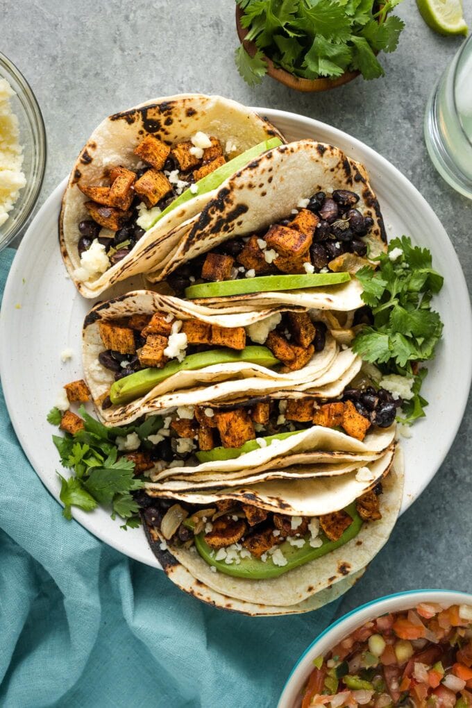Sweet potato black bean tacos served on a plate.