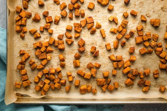 Sheet pan with roasted sweet potatoes.