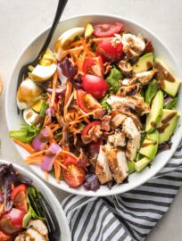 Overhead image of balsamic grilled chicken Cobb salad, served in a bowl for a large individual salad.