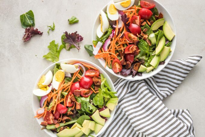 Salads with eggs and avocado added.