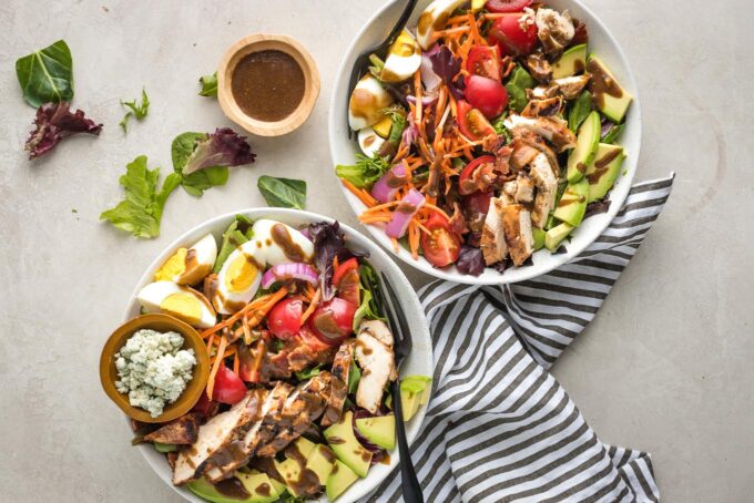 Two salads, ready to eat.