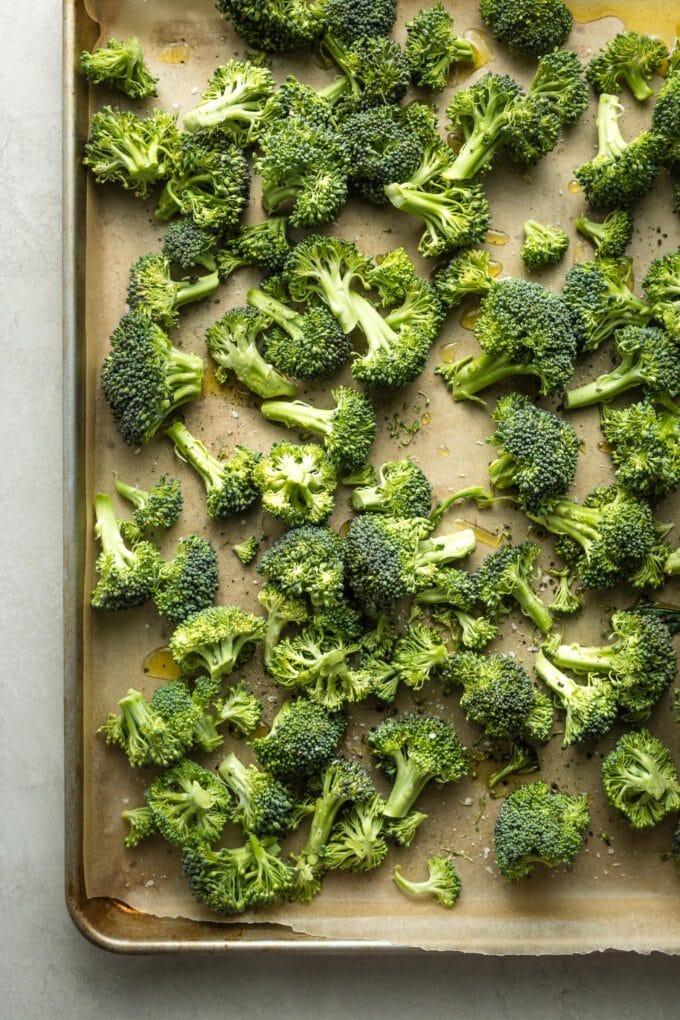 Broccoli florets on a sheet pan.