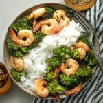 Bowl of white rice, broccoli, and honey garlic shrimp.