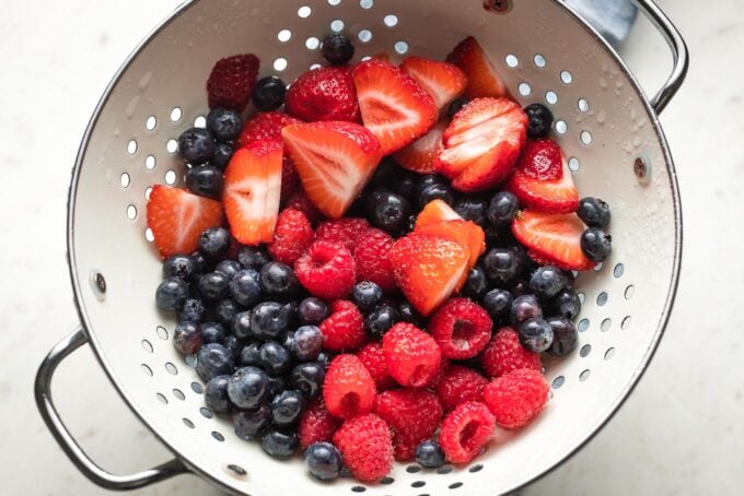 Just-washed berries in a colander.