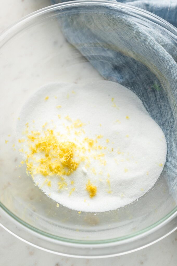 Sugar and lemon zest in a prep bowl.