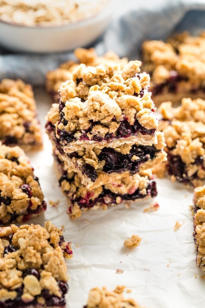 View of blueberry oat crumb bars from the side, highlighting the jammy middle layer.