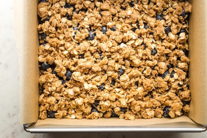 Close-up of blueberry oat crumb bars in their baking pan.