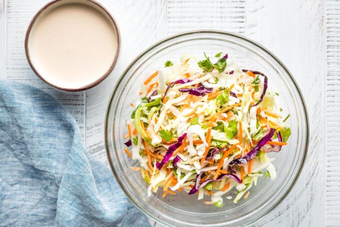 Slaw and crema in prep bowls.