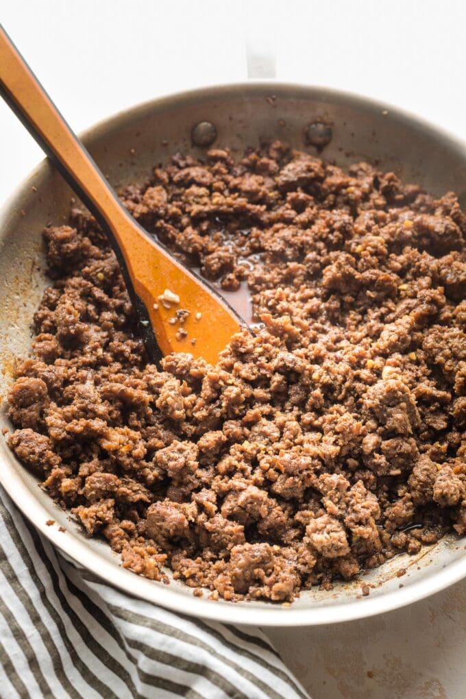 Korean ground beef sizzling in a skillet.