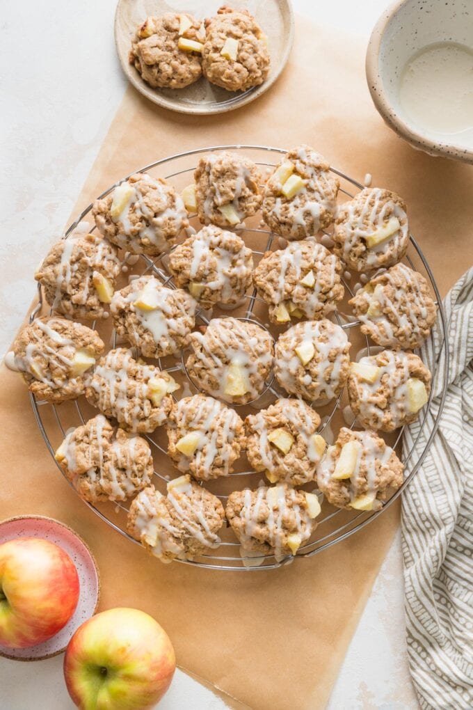 Wire rack filled with maple glazed-apple cinnamon oatmeal cookies.