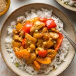 Pineapple chicken served with rice.