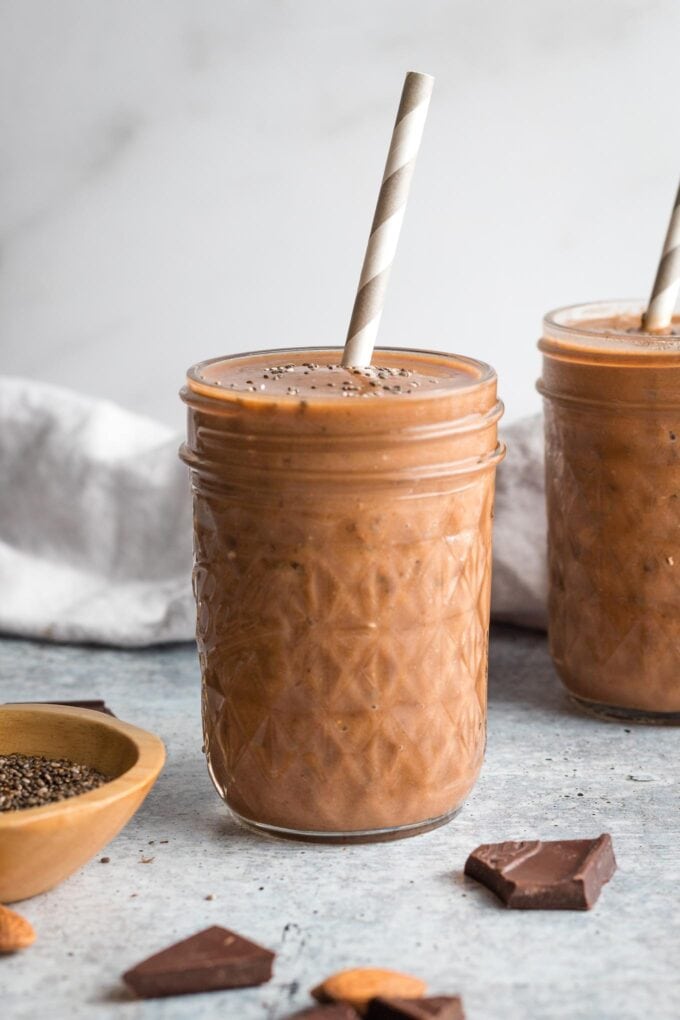 Small jar holding a chocolate almond milk smoothie.