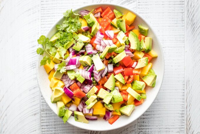 Ingredients for salsa in a bowl.