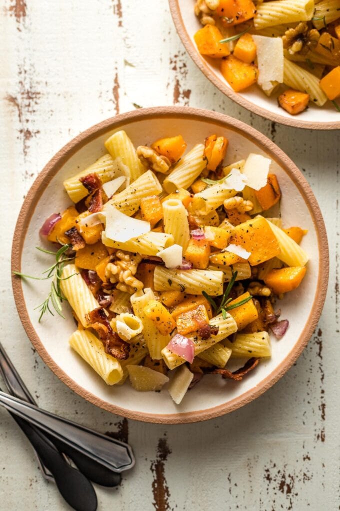 Plates of roasted butternut squash pasta ready to serve.