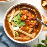 A bowl of vegetarian tortilla soup.