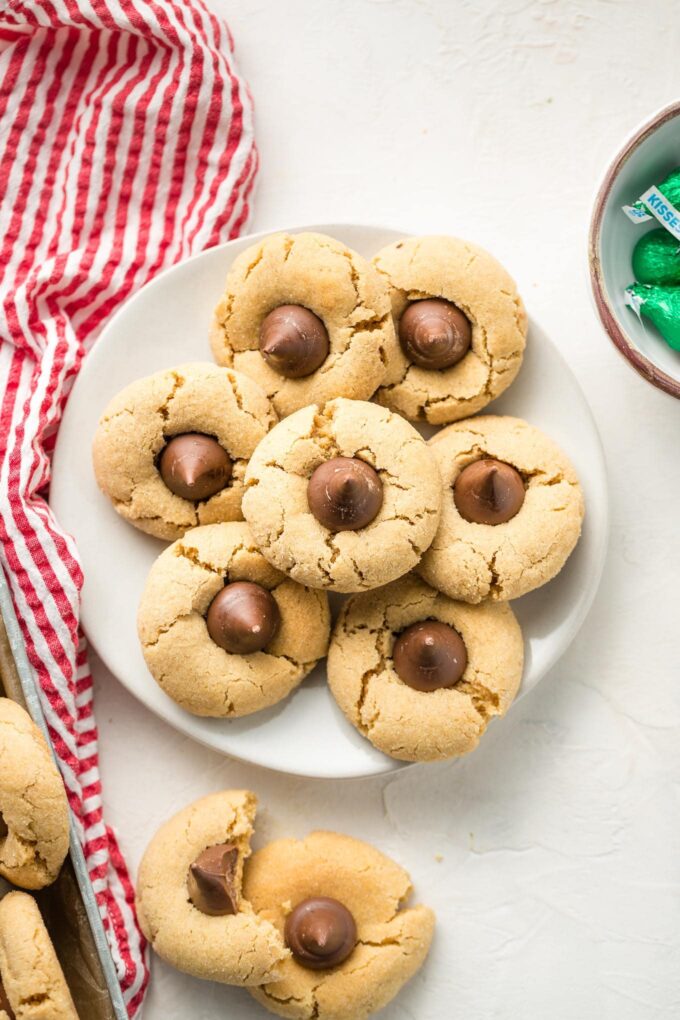 White plate full of peanut butter blossom cookies.