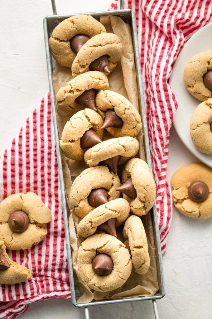 Galvanized metal tray full of peanut butter blossom cookies.
