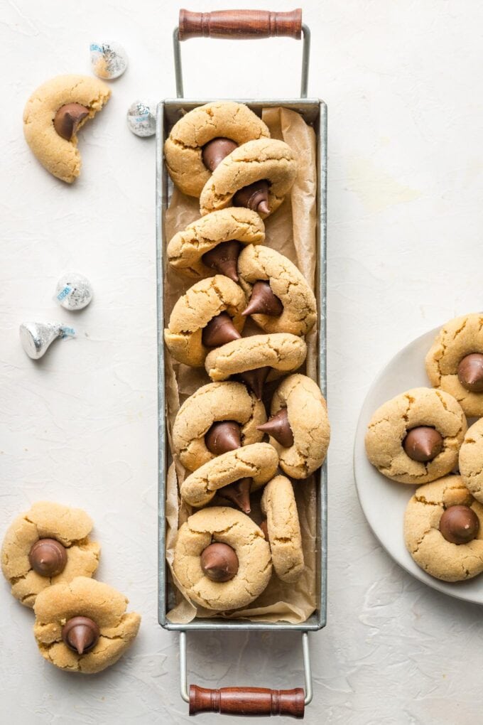 Galvanized metal tray full of peanut butter blossom cookies.