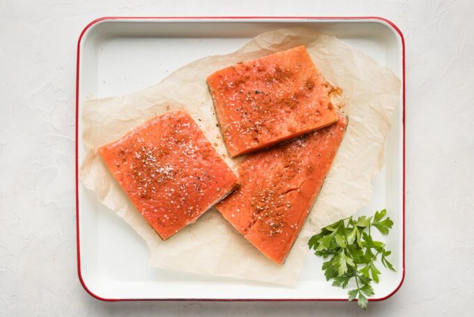 Seasoned raw salmon filets.
