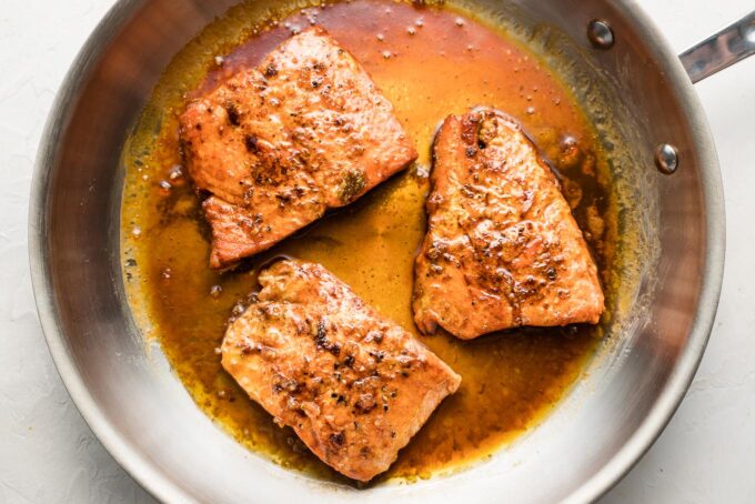 Cooked salmon filets with honey garlic sauce.
