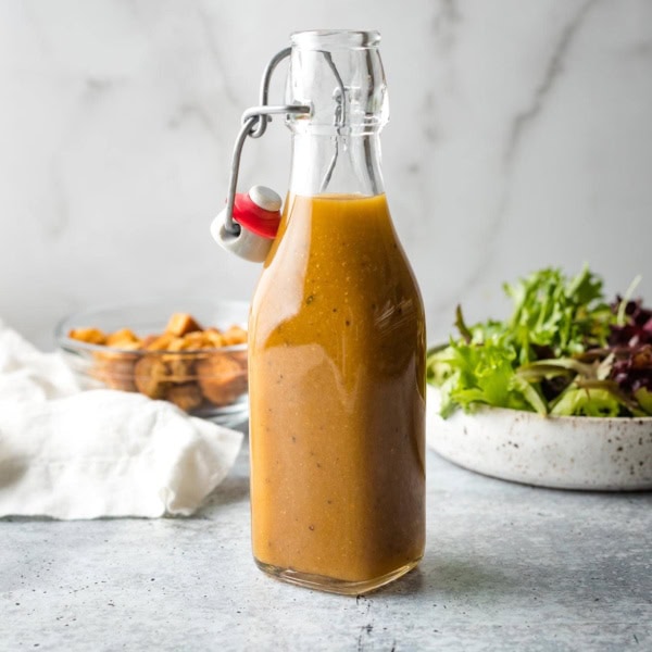 Small bottle holding homemade balsamic vinaigrette.