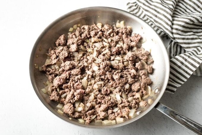 Crumbled ground beef in a skillet.