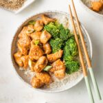 Bowl of homemade teriyaki chicken served with steamed broccoli and rice.