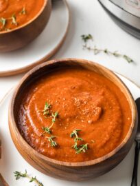 Fire roasted tomatoes infuse this Instant Pot tomato soup with a sweet-smoky flavor that's hard to resist! Simmered-all-day taste with minimal effort.