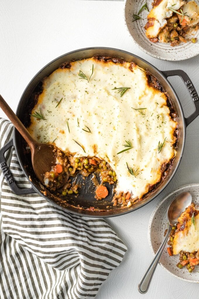 Deep skillet with a vegetarian Shepherd's pie partially served.