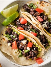 These simple Black Bean Tacos are so easy to make from pantry staples, and the filling cooks in no time. So flavorful and satisfying that you'll never miss the meat!