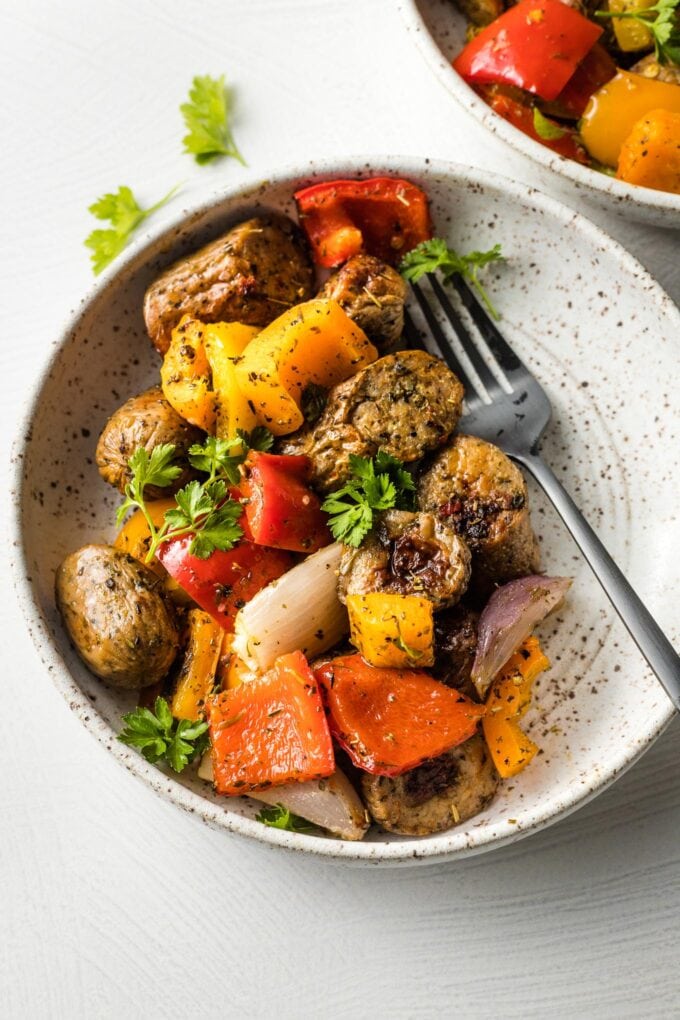 Bowl filled with sausage and peppers with fennel.