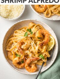 Blackened Shrimp Alfredo is a home-run dish with pan-fried shrimp and tender pasta swimming in a simple yet irresistible cream sauce. You can easily control the heat and have this impressive meal on the table in 30 minutes.