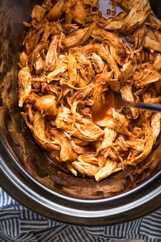 Crockpot full of pulled BBQ chicken.