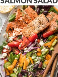 This simple Greek Salmon Salad with pan-seared filets, a rainbow of fresh veggies, and an easy Mediterranean-inspired vinaigrette makes a deliciously feel-good lunch or dinner.