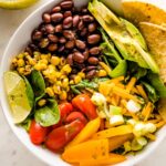 Close up of a vegetarian taco salad with black beans.