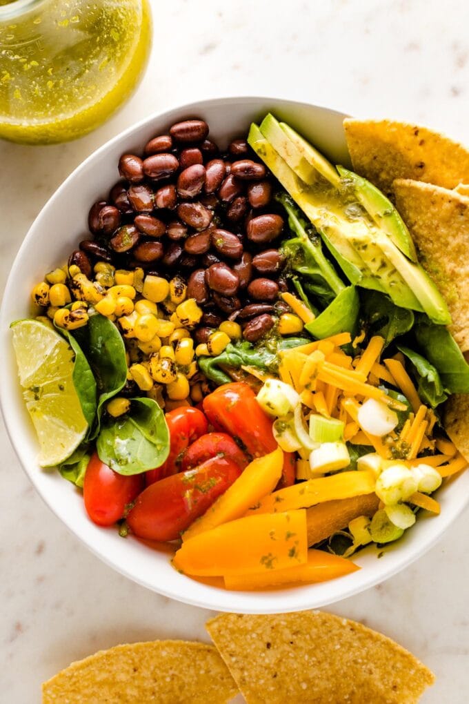 Close up of a vegetarian taco salad with black beans.