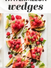 Watermelon Raspberry Mint Wedges: summer on a plate! Slices of crisp watermelon piled high with sweet berries, dusted with zippy mint, lime, and sea salt, then drizzled with tangy balsamic glaze. Serve as an appetizer, snack, or even a salad.