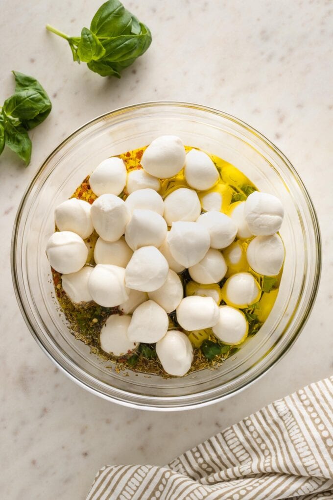 Mozzarella balls added to mixing bowl.