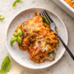 Plate with a heaping portion of baked ravioli.