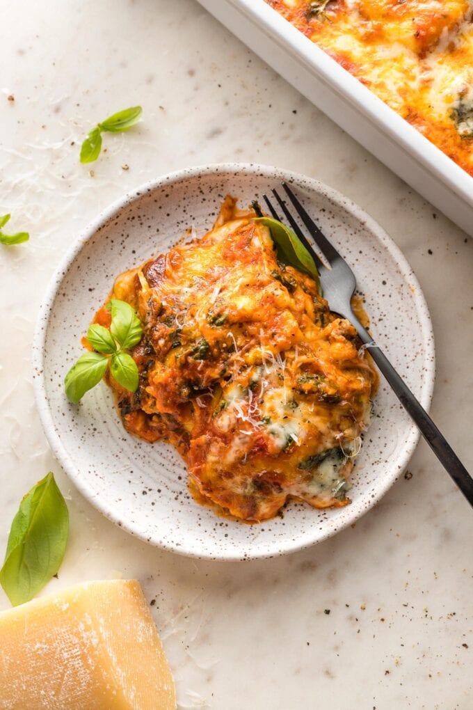 Plate with a heaping portion of baked ravioli.